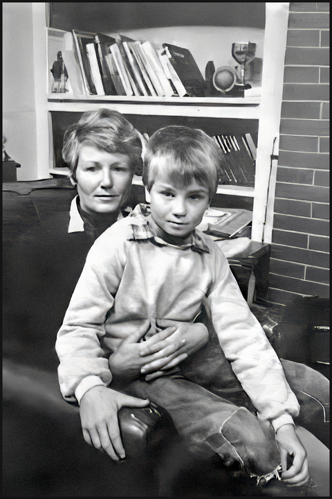 Photo of Blair Robertson, a 9-year-old schoolboy from Tapanui, sitting on his mother's knee.