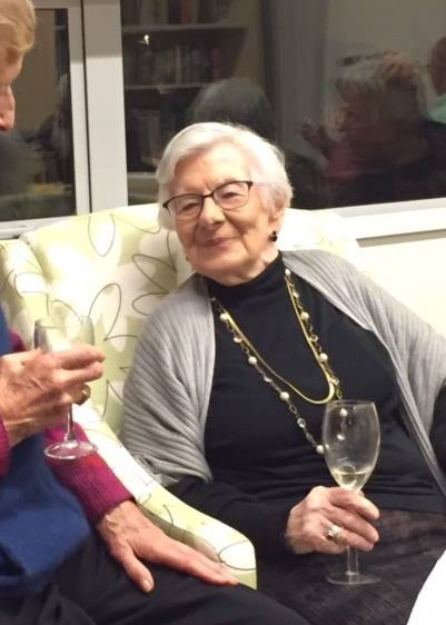 Picture of Jacqueline Steicamp holding a glass of wine
